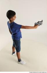 TIMBO STANDING POSE WITH GUN